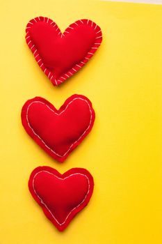 red heart valentine gift holiday romance yellow background. High quality photo