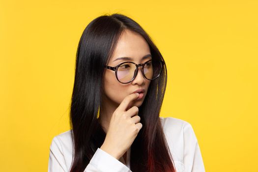 pretty woman with glasses attractive look elegant style yellow background. High quality photo