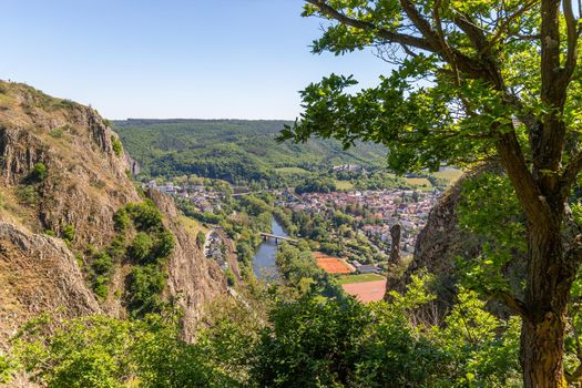 High angle view from the Rotenfels of Bad Muenster am Stein Ebernburg with rocks and tree n the foreground