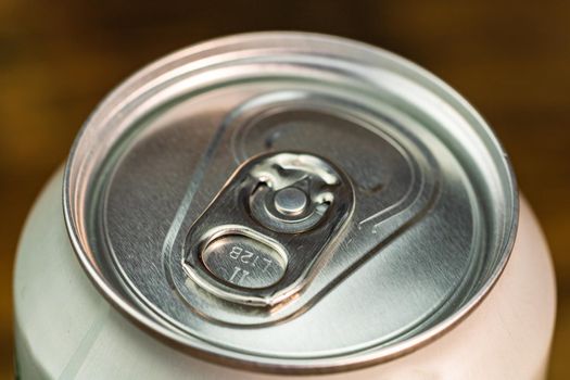 Macro detail of metallic beer can, view from the top