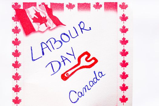 Labour day Canada handwriting on paper with Canada flag. Writing text on memo post reminder. Bucharest, Romania, 2020.