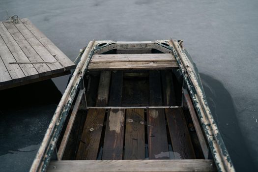 wooden boat near the pier on the nature in the river. High quality photo