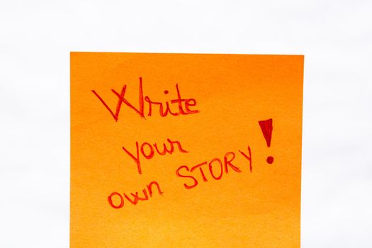 Write your own story handwriting text close up isolated on yellow paper with copy space.