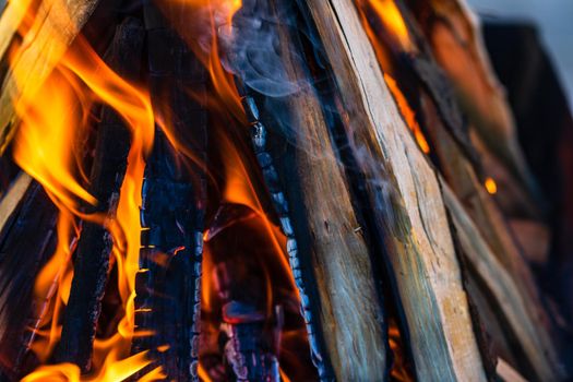 Burning wood chips to form coal. Barbecue preparation, fire before cooking.