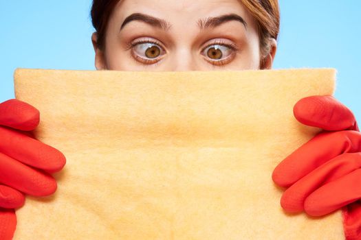 cleaning lady in rubber gloves holding a rag in her hands closeup emotion. High quality photo