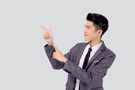 Portrait young asian business man pointing and presenting isolated on white background, advertising and marketing, executive and manager, male confident showing success, expression and emotion.