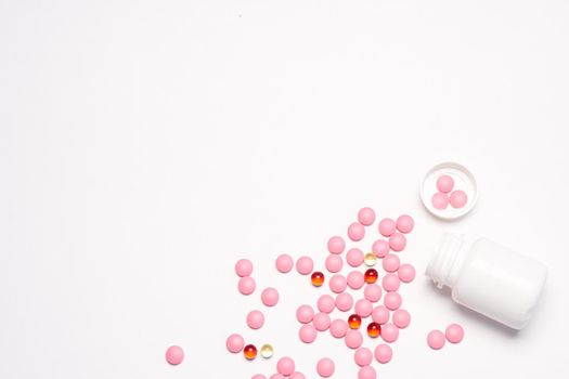 White jar with pills on a light background top view medicine health vitamins. High quality photo