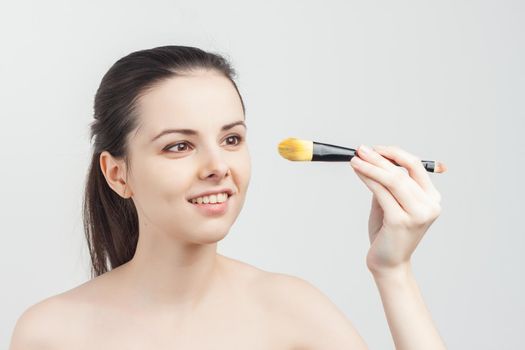 woman naked shoulders face cream skin care cosmetology close-up. High quality photo