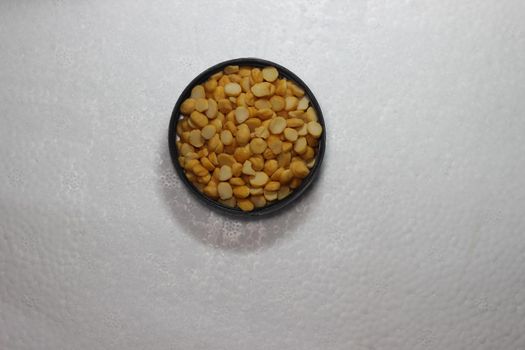 Top view of cereals on white background with copy space. Split Chickpea Also Know as Chana Dal or Toor Dal