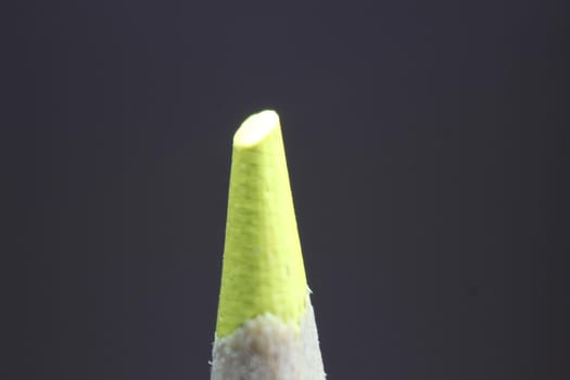 close up of sharpened pencil.Macro view of the tip of the pencil on a black background.