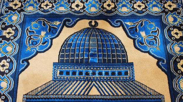 Closeup view of prayer rug in place to make prayer. High angle view of lovely prayer mat or prayer rug for Muslims