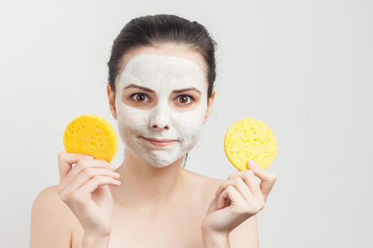 woman holding sponges in hands removing makeup. High quality photo