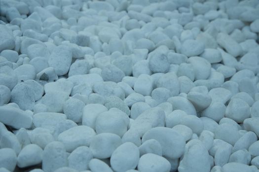 Top view of white stones background.