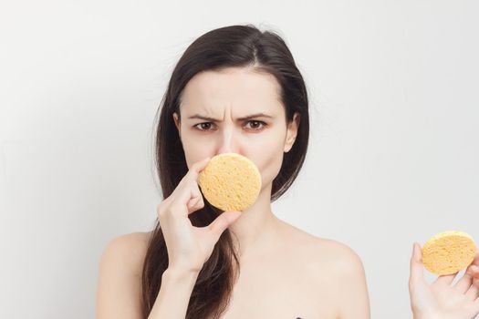 brunette bare shoulders cosmetics skincare cropped view. High quality photo