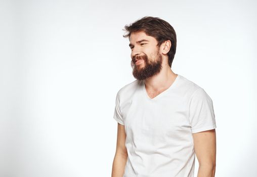 energetic man with beard on white background gesturing with hands cropped view. High quality photo