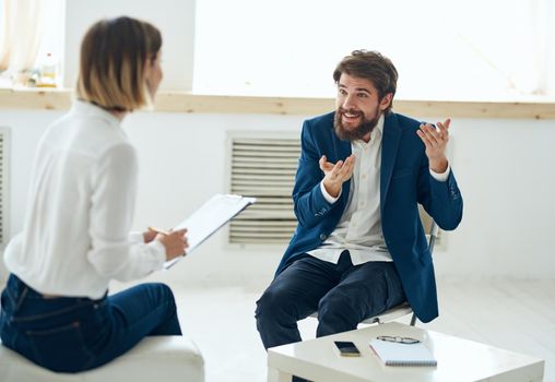 A man at the reception of a psychologist communication consultation depression treatment. High quality photo