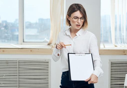 white sheet of paper mockup Woman rooming near window interior Folder . High quality photo
