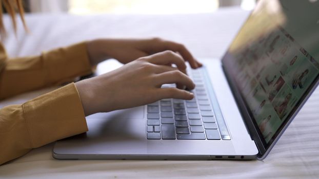 laptop typing with hands work at home internet technology. High quality photo