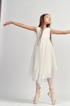 Cute little girl ballerina dance performed studio. High quality photo