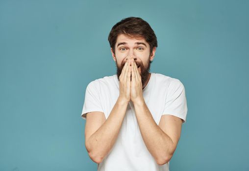 portrait of an enthusiastic man On a blue background cropped view Copy Space. High quality photo