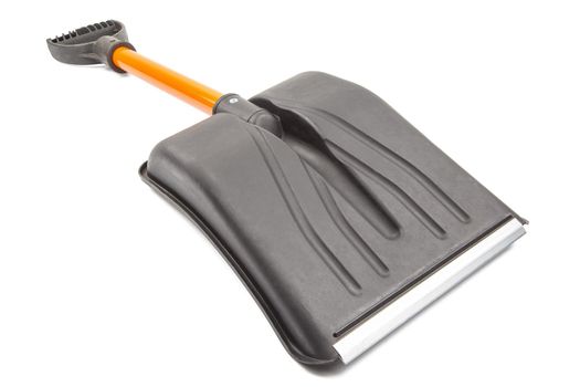 small plastic snow shovel, isolated on white background - back side, laid down, diagonal perspective blade toward camera