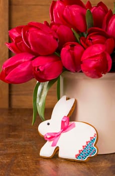 Fresh pink tulips on the wooden background