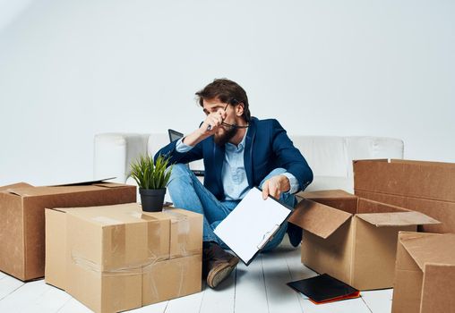 business man documents boxes unpacking professional office. High quality photo