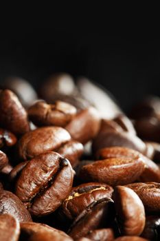 Closeup of coffee beans on black backround