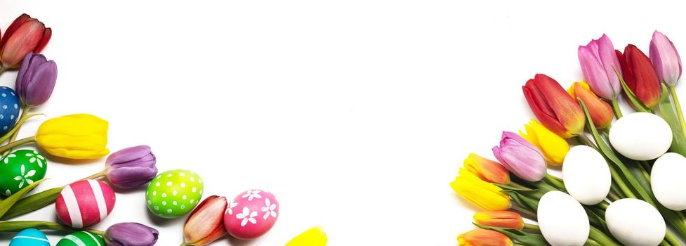 Hand-painted easter eggs with tulips isolated on white background frame with copy space for text