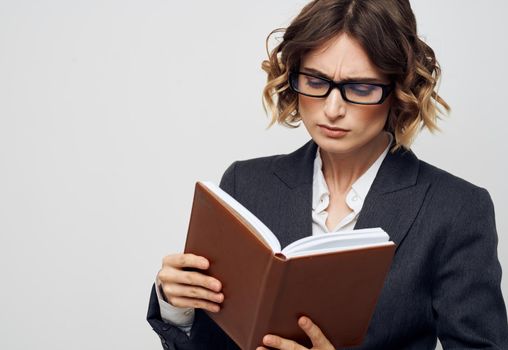 Business woman classic suit book bound finance model. High quality photo