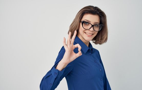 Business woman in blue shirt strict style manager. High quality photo