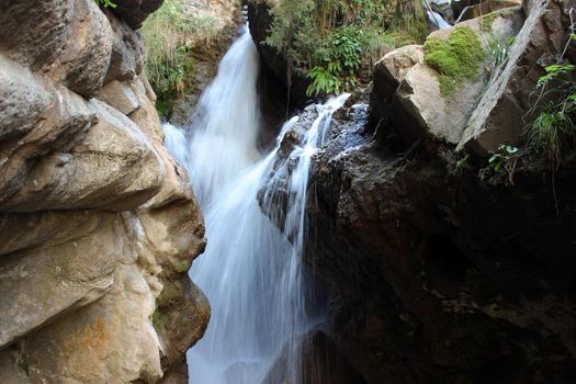 Mountain waterfall in the mountains of the North Caucasus. A high-quality photo.