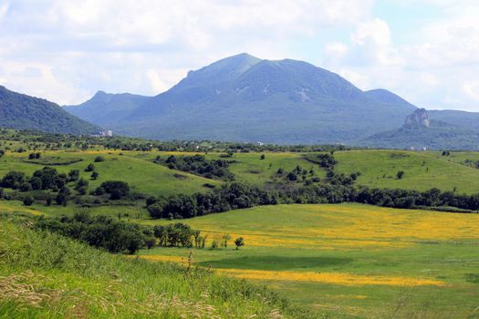 Mountain landscape, road to the mountains. Travel in the mountains.