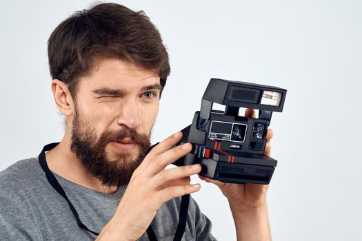 Male photographer holding a professional camera tasty technology hobby. High quality photo