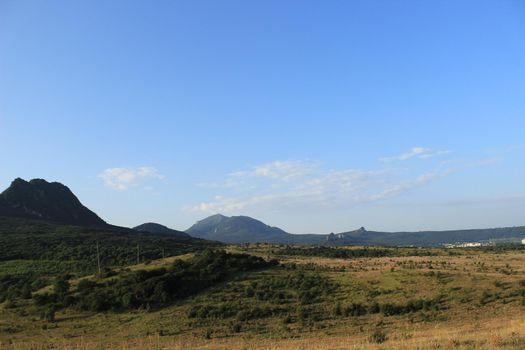 Summer natural landscape with mountains in the background.