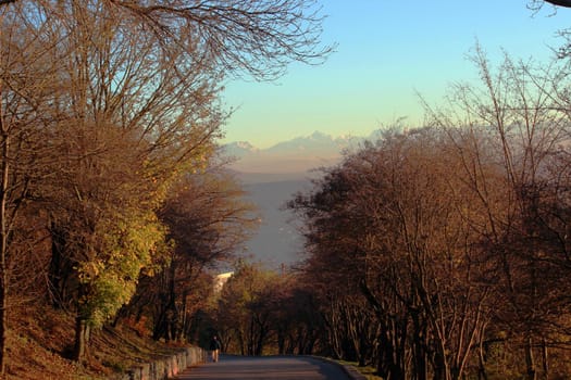 Beautiful nature. Autumn landscape with a footpath and mountains in the background.