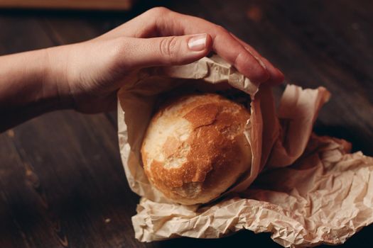 loaf of bread flour product wooden board tray and paper packaging. High quality photo