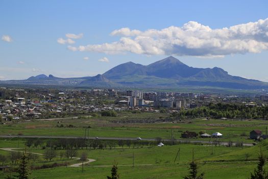 Beautiful natural landscape with green vegetation and mountains in the background.