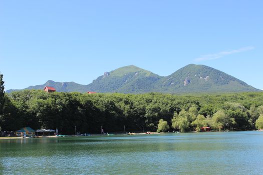 Decorative lake in the park near the mountain.