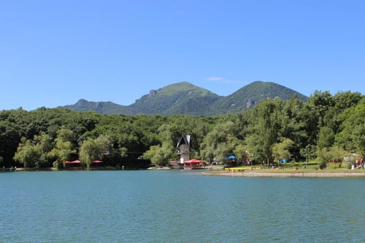 Decorative lake in the park near the mountain.