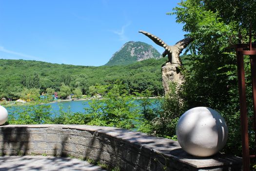 A decorative lake overlooking the mountain in the park.