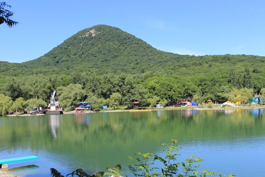 Decorative lake in the park near the mountain.