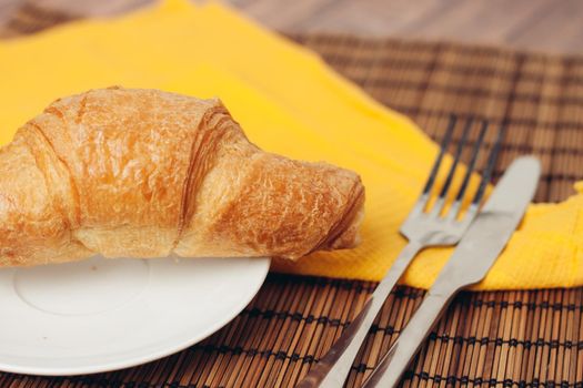 fresh croissants on the table coffee cup breakfast . High quality photo