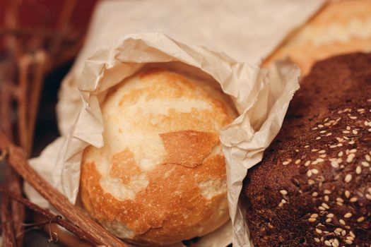 flour product loaf of bread baked goods on the branches of the nest close-up. High quality photo