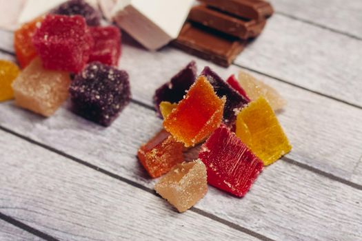 multicolored marmalade candy sweets dessert wooden background. High quality photo