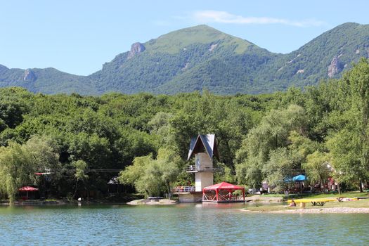 Decorative lake in the park near the mountain.