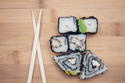 japanese cuisine sushi chopsticks wood cutting board. High quality photo