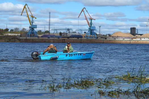 River sand mining. A wide river, a view from the shore.