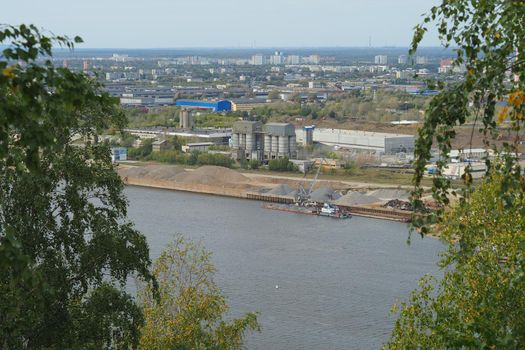 River. Seaport Production on water. Sand mining and shipping.