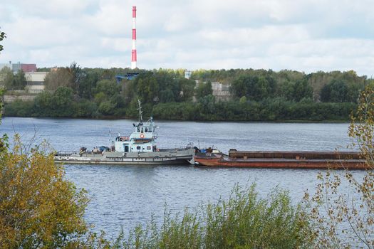 River. Seaport Production on water. Sand mining and shipping.